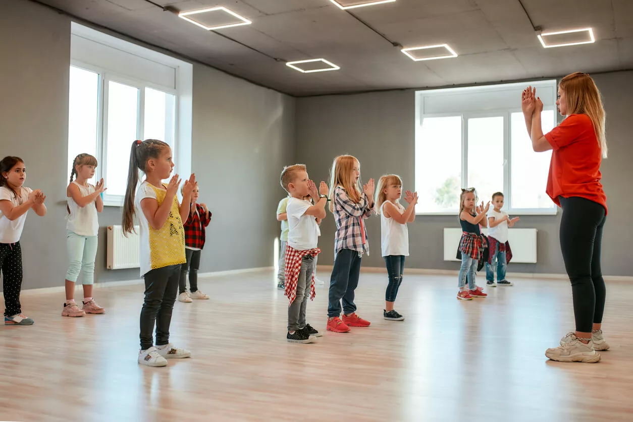 Dance Instructor Leading Dance Class In Dance Studio