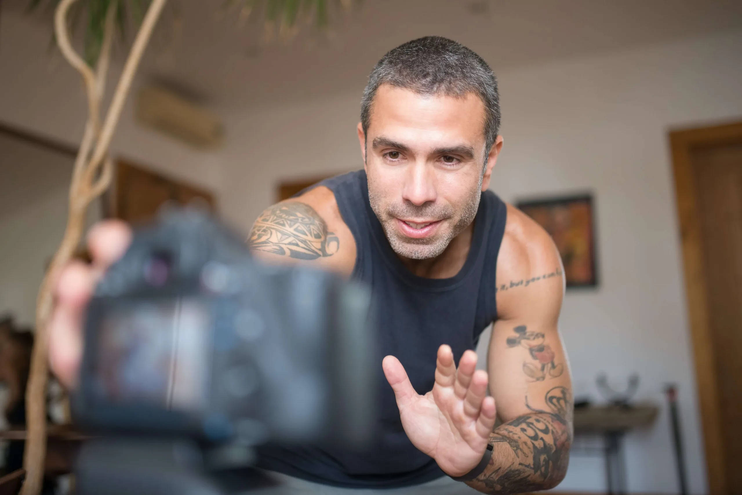 a personal trainer filming himself for his client